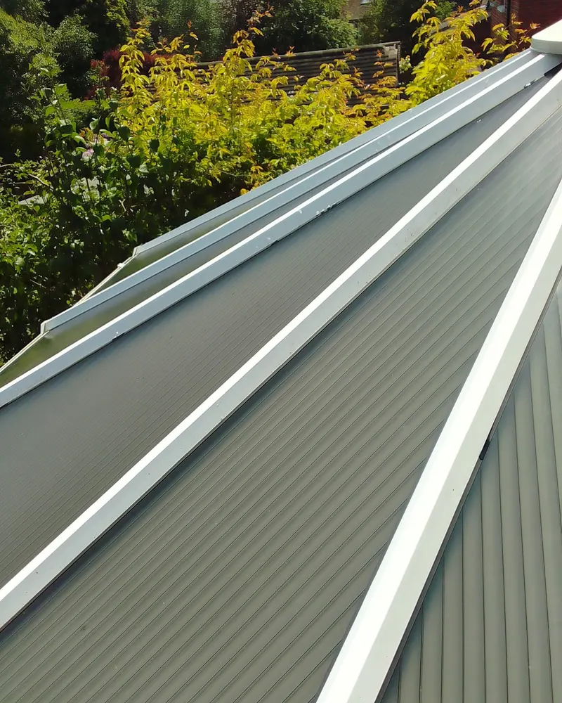 Clean conservatory roof panels with white frames